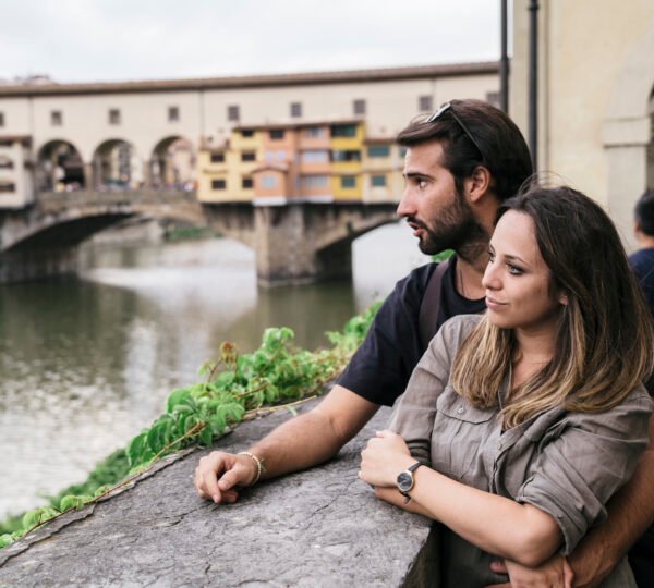 Young couple in honeymoon visiting an european historical city
