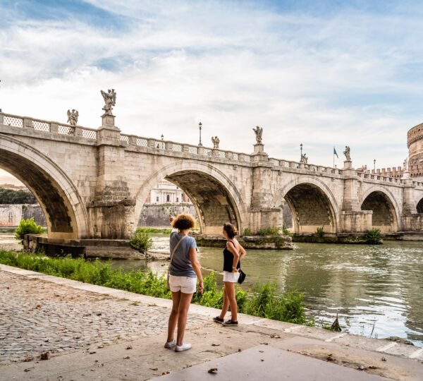 Rome, Italy - August 18, 2016:  Bridge and Mausoleum Castel Sant Angelo at sunset. The Mausoleum of Hadrian, usually known as Castel Sant'Angelo is a towering cylindrical building in Rome